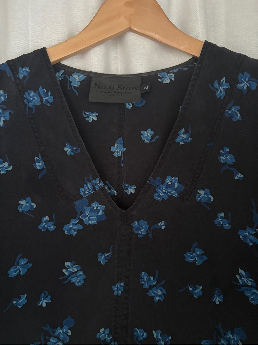 No. 6 Black V-Neck Blouse with Blue Floral Pattern